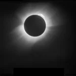 An original high-resolution image of the 1919 solar eclipse, before the digital restoration would reveal a few pinpoint stars visible just above the large prominence arching across the Sun’s upper right limb. Another is visible below the Sun’s limb and beyond it’s wispy corona near the bottom of the image F.W Dyson, A. S. Eddington, and C.Davidson. Credit: NASA
