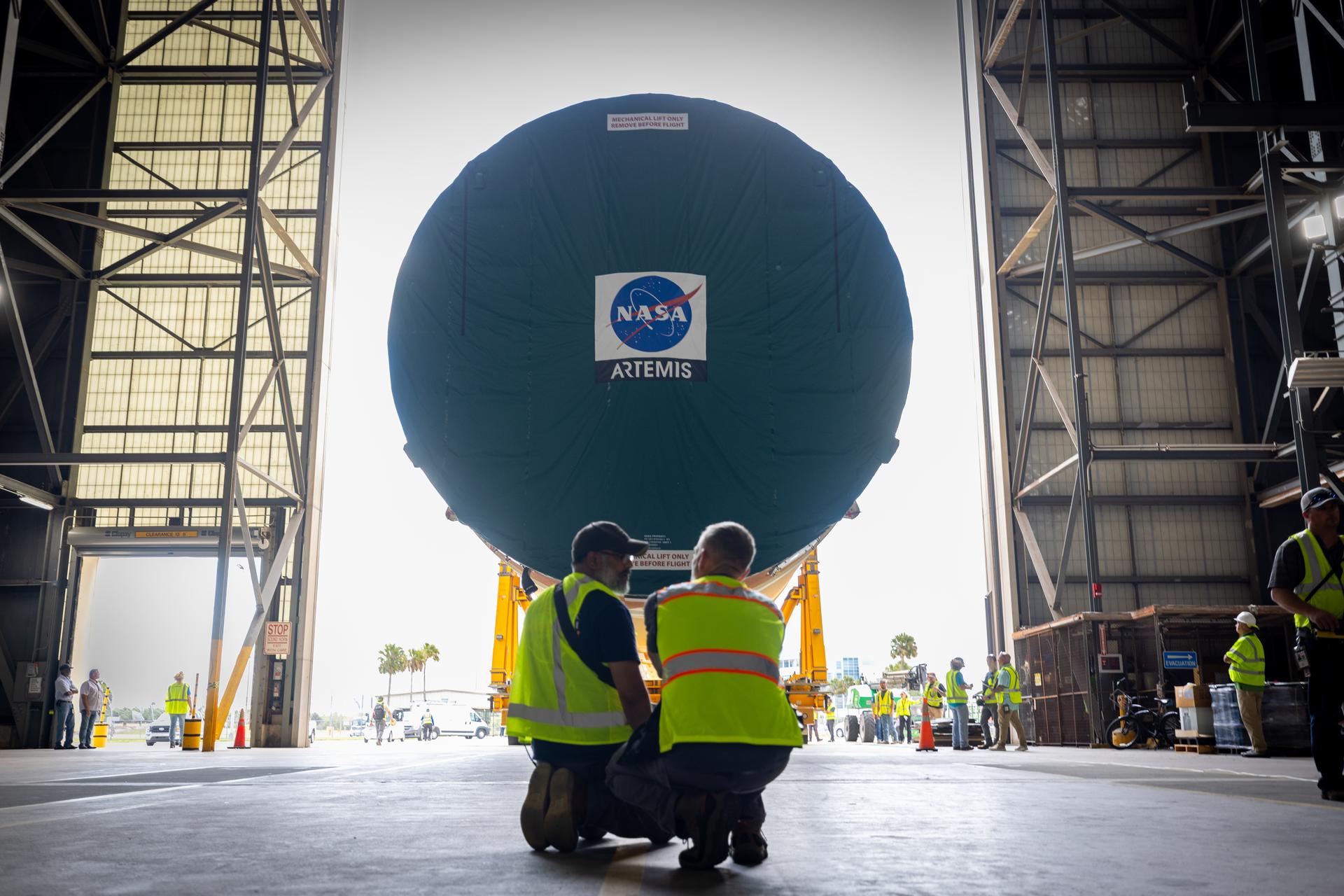 Part of the SLS core stage arrives in the transfer isle of the VAB (Vehicle Assembly Building), for Artemis III in Florida, on April 28th, 2026. Credit: NASA / Frank Michaux
